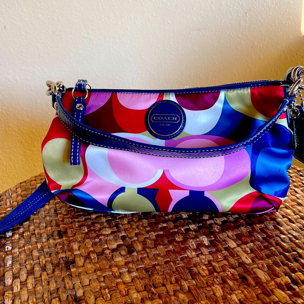 Coach purse with detachable shoulder strap and leather handle